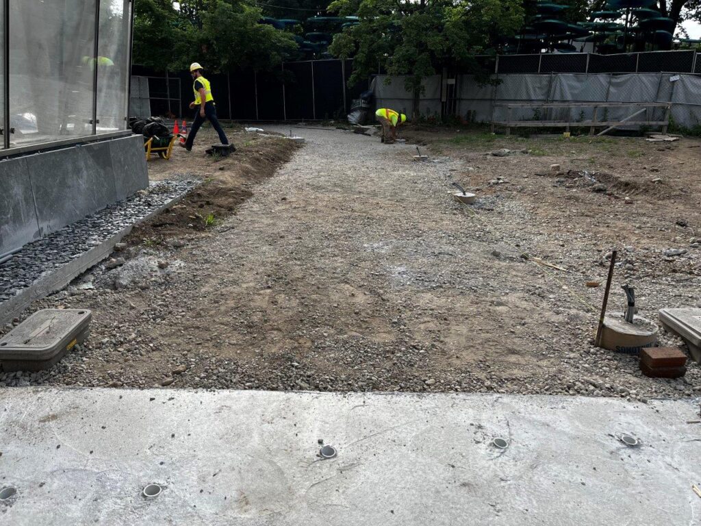 Subgrade has been placed and compacted for a new park brick walkway leading to the station.
